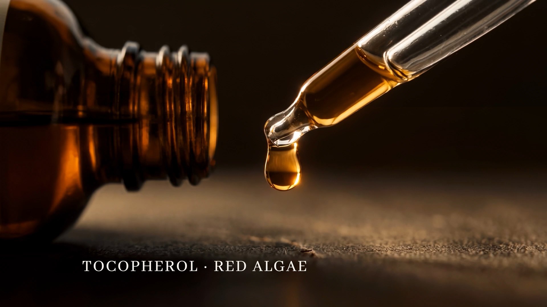 A drop hanging from the pipette with the title Tocopherol, Red Algae